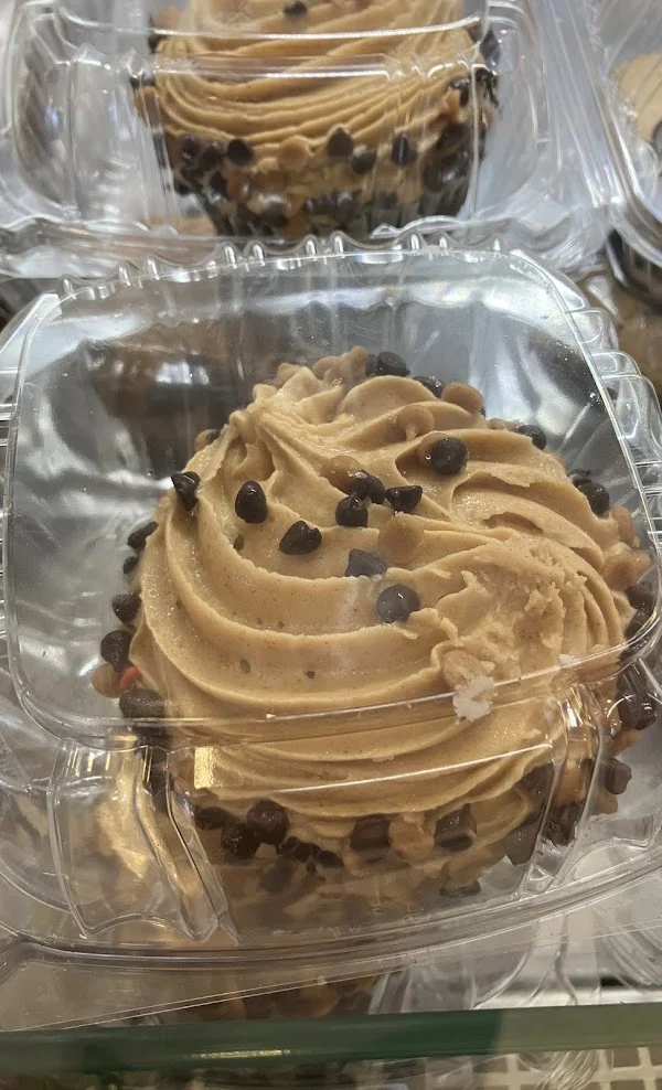Peanut butter chocolate chip cake in a clear box from the dessert case