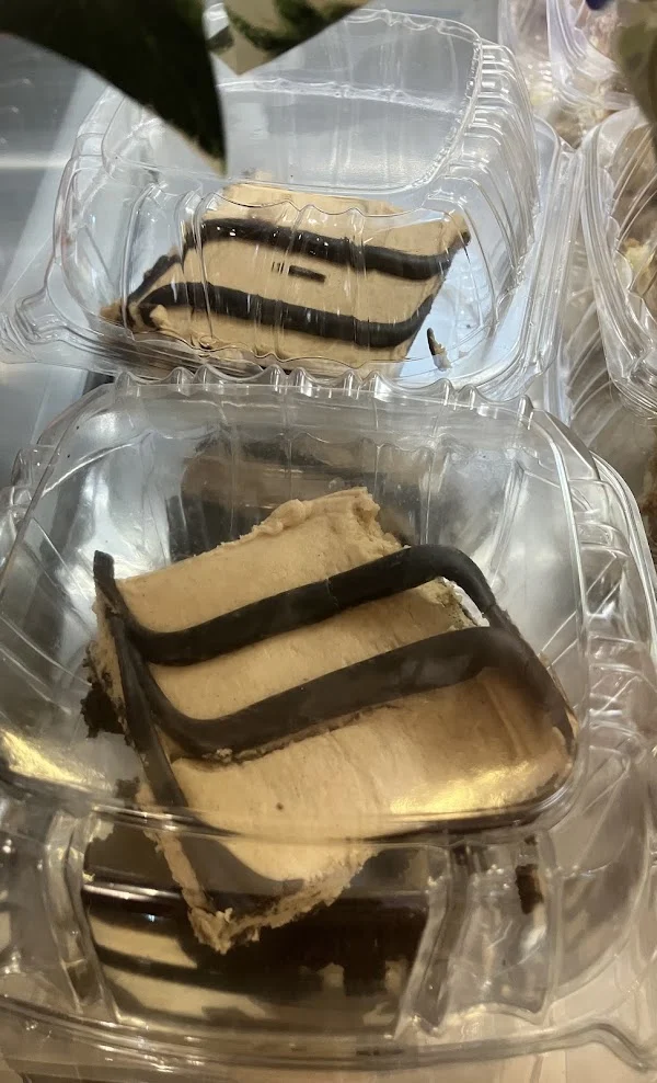 Slices of layered cake packed in clear containers