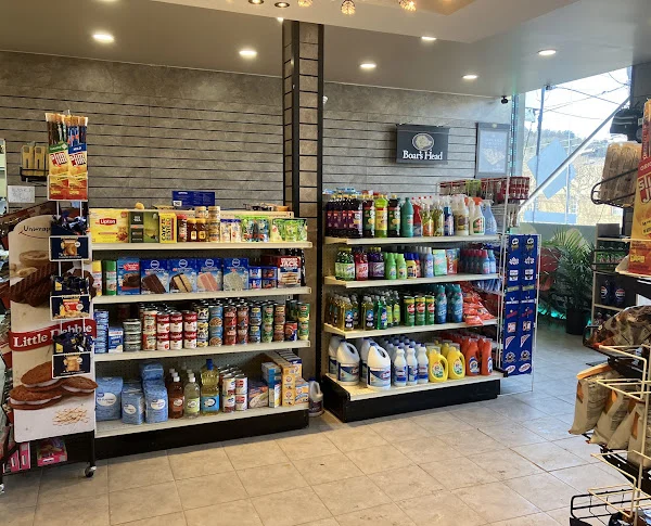 Grocery shelves with canned goods, pantry staples and household items
