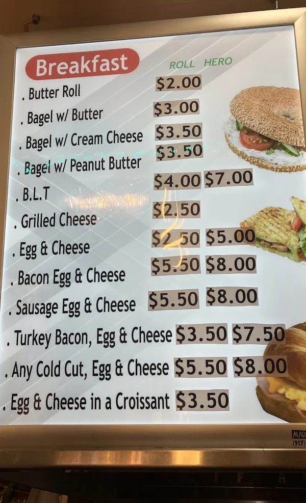 Breakfast menu board listing rolls and heroes with prices